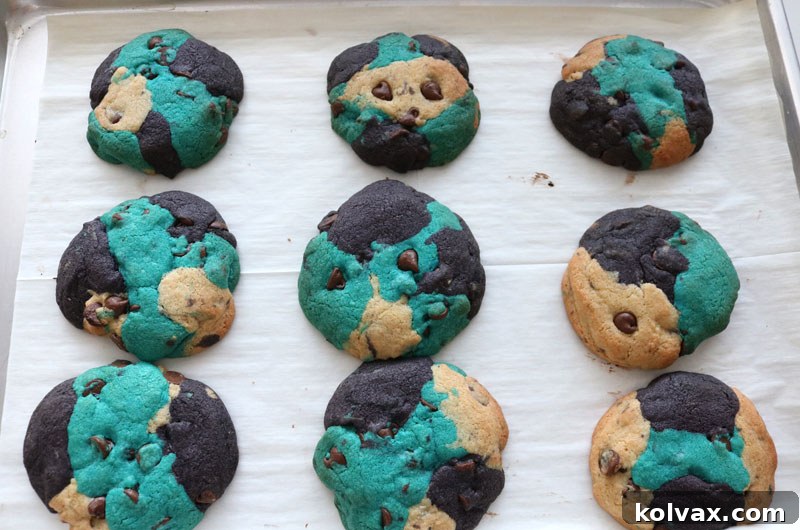 Freshly baked Jacksonville Jaguars chocolate chip cookies, golden brown around the edges and still warm from the oven, cooling on a rack. Ready for a game day celebration!