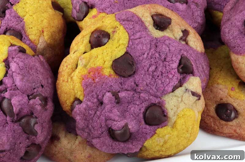 A stunning close-up of a stack of Minnesota Vikings Chocolate Chip Cookies, showcasing the vivid purple, gold, and white marbling and delicious chocolate chips. Perfect for Game Day!