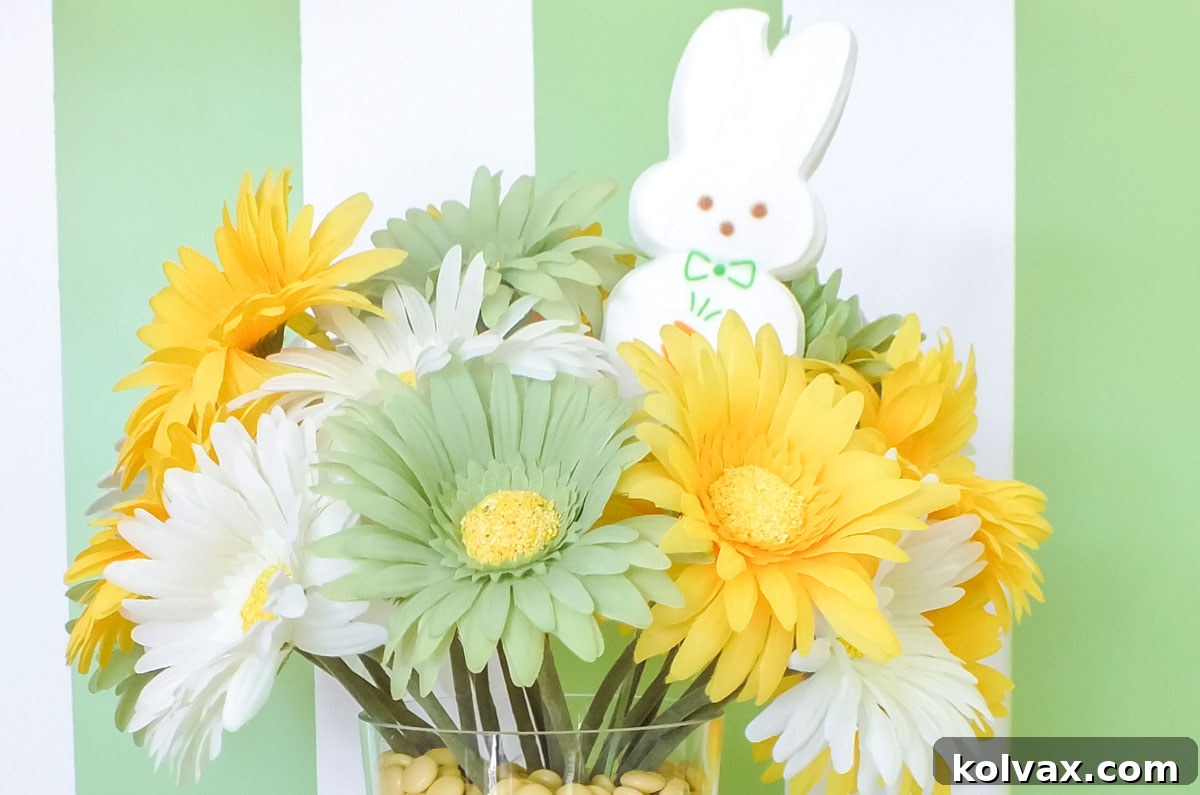 Close up of the large white Peeps Candy bunny decorating the easter flower centerpiece arrangement, playfully emerging from the blossoms.
