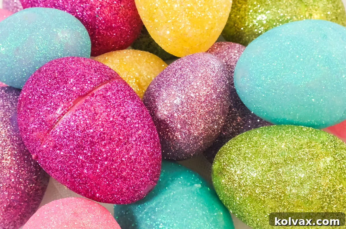 Closeup on a pile of Homemade Glitter Easter Eggs in many colors, showcasing their vibrant sparkle.