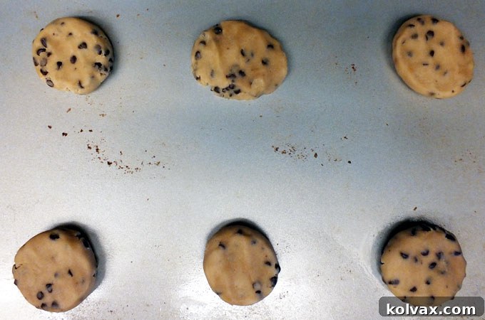 Preparing Spring M&M Cookies for baking by rolling dough balls