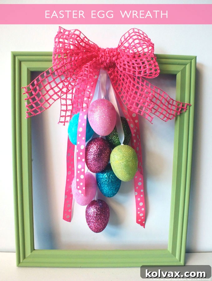 Vibrant Easter Egg Creations 3 Unique Easter Egg Wreath crafted from an upcycled frame, adorned with glitter eggs and pink ribbon