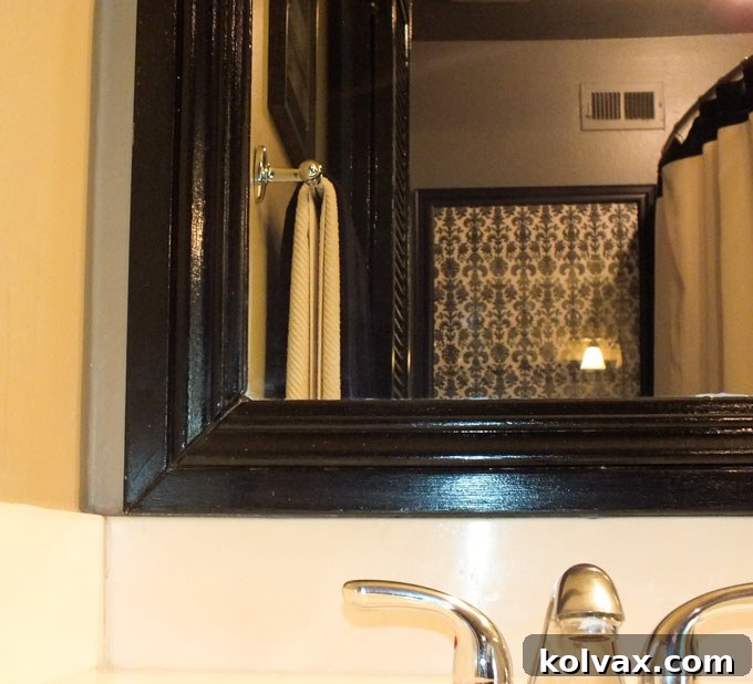 Detailed picture of mirror trim adding elegance to the bathroom
