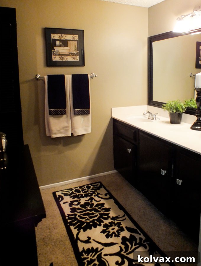 DIY Bathroom Makeover for Under $100 - See the stunning transformation of an outdated bathroom. Follow us for more Home Project Crafts!