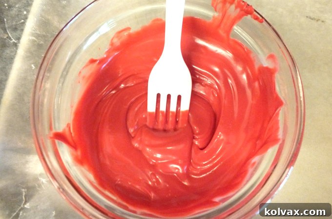 Melted candy wafers ready for dipping, showing smooth and glossy texture