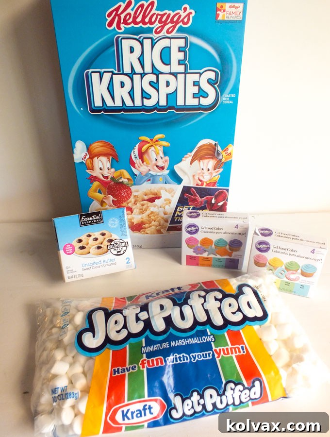 A selection of ingredients including Rice Krispies, marshmallows, butter, M&Ms, and food coloring