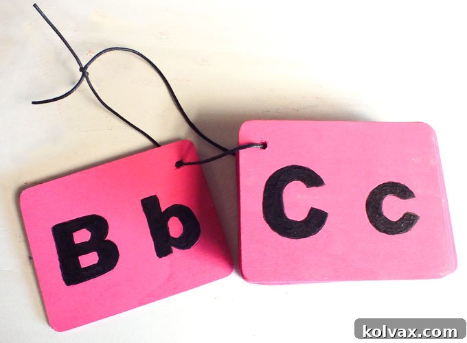 Stringing together the chalkboard letter blocks with cording