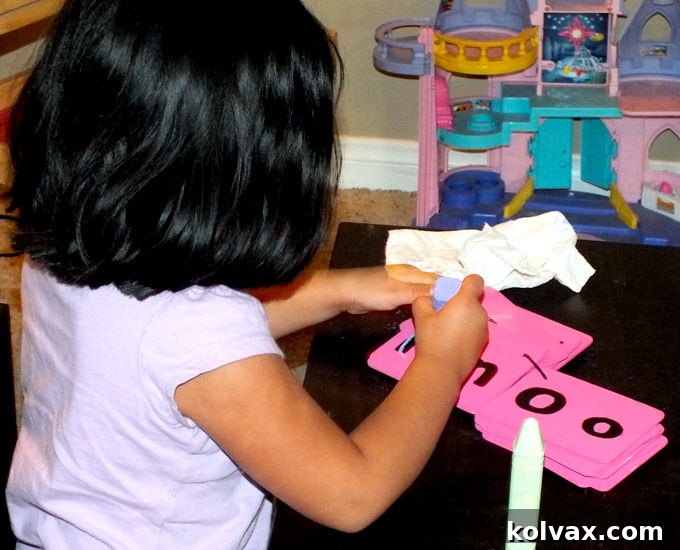 Child using the DIY Chalkboard Letter Practice Set for handwriting