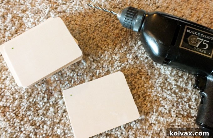 Drilling holes in wooden rectangles for craft project