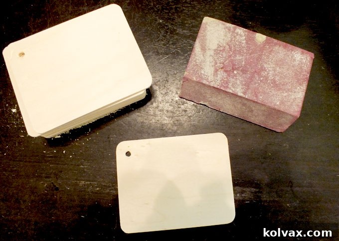 Sanding the wood rectangles for a smooth finish