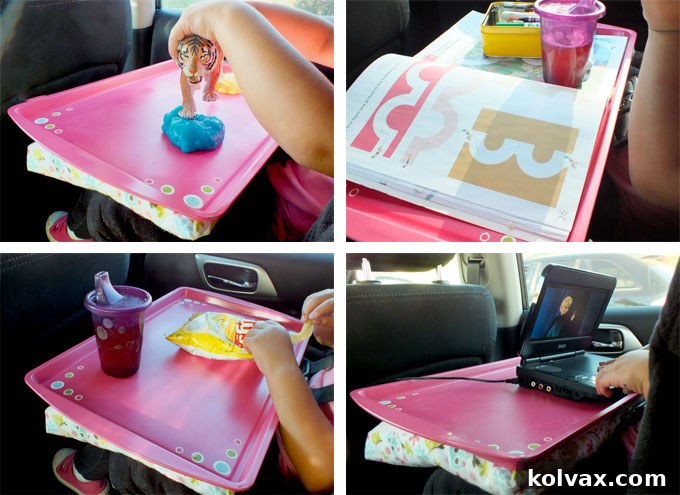A child engaged in activities on her DIY Road Trip Travel Tray during a car journey.