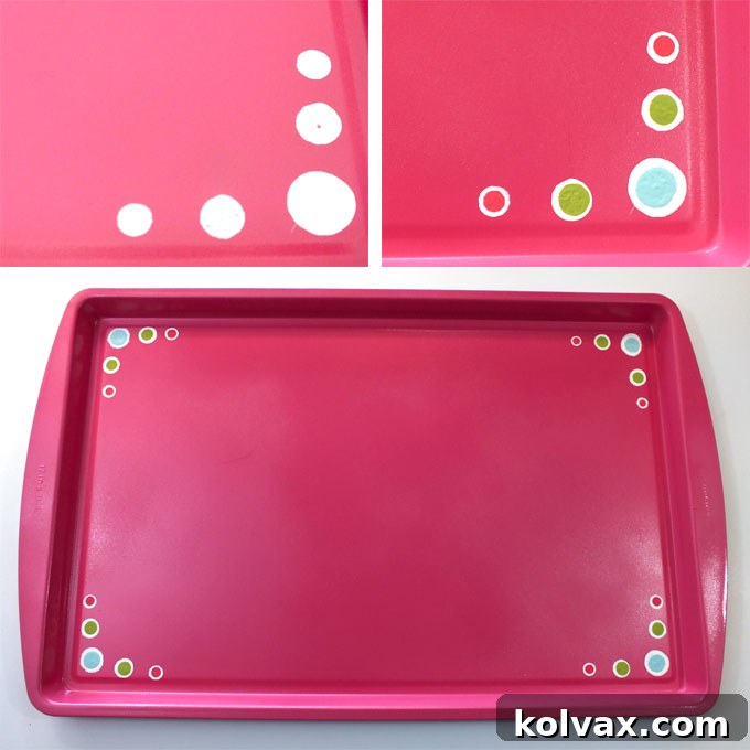 Embellishing a painted travel tray with craft paint and dauber brushes for a personalized touch.