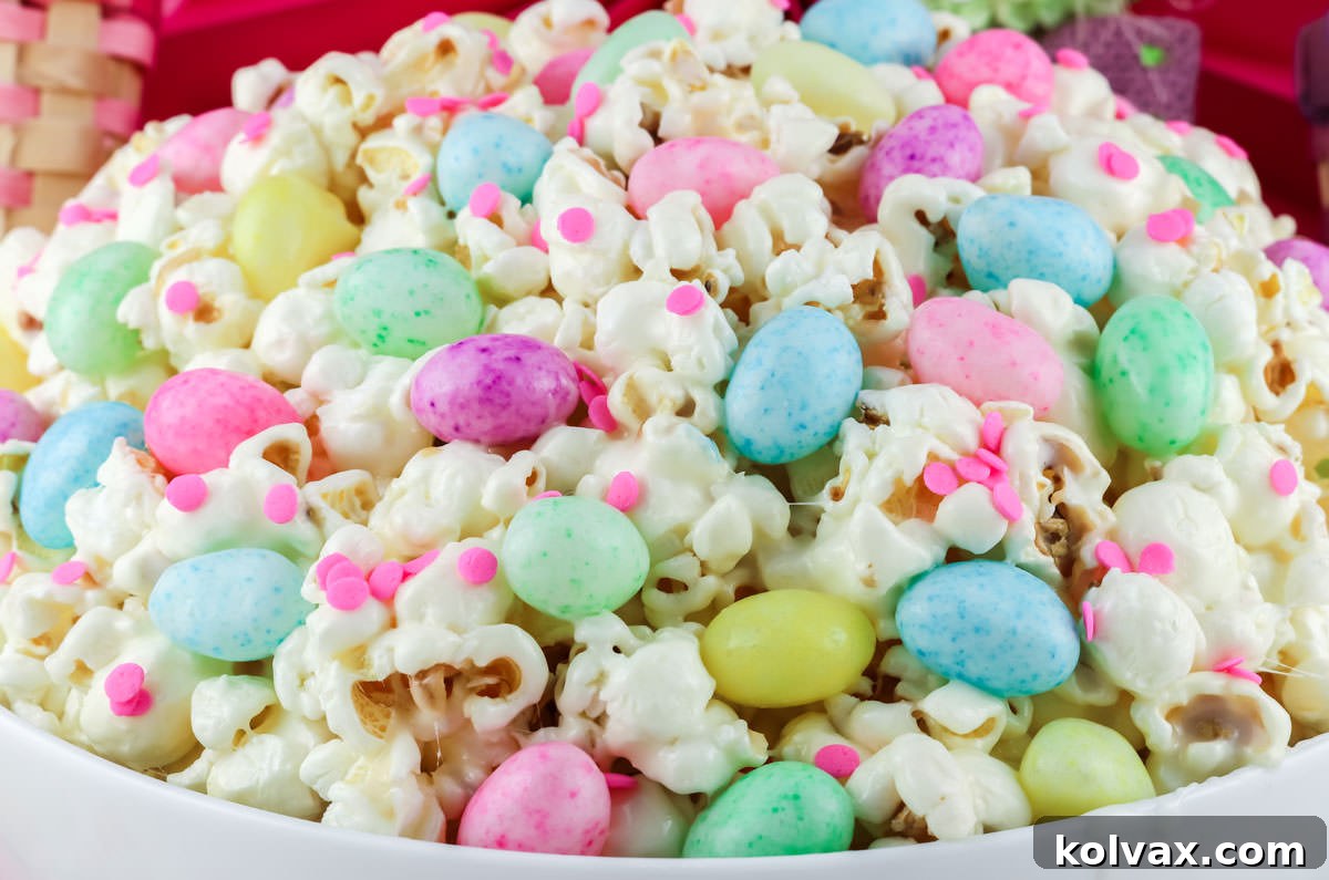 A close-up shot of a white bowl overflowing with fluffy marshmallow popcorn, artfully adorned with cheerful pink sprinkles and an assortment of pastel-colored jelly beans, evoking the festive spirit of Easter.