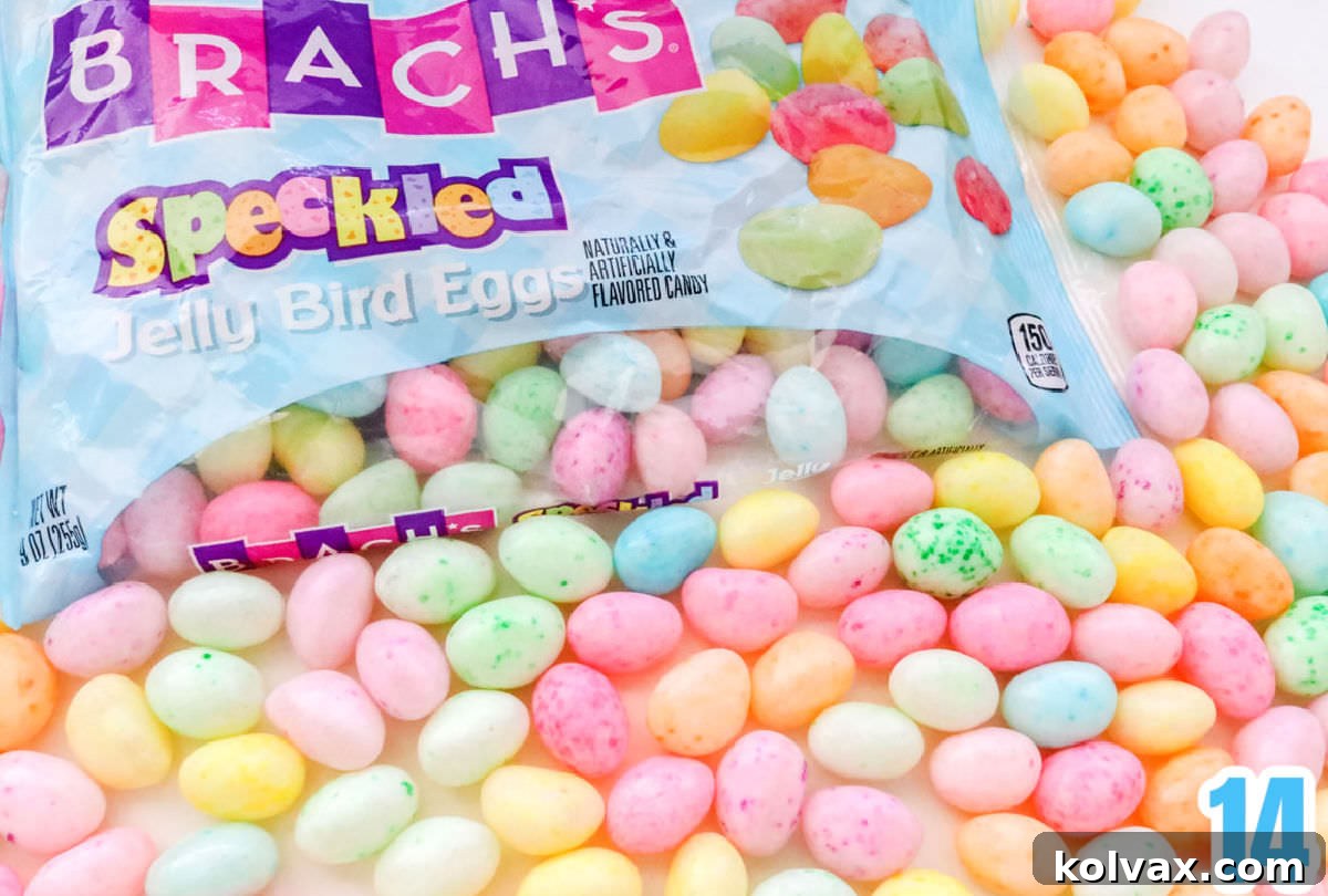 A close-up view of an opened bag of Brach's Speckled Jelly Bird Eggs, showcasing their beautiful pastel colors, ready to be added to the Easter popcorn.