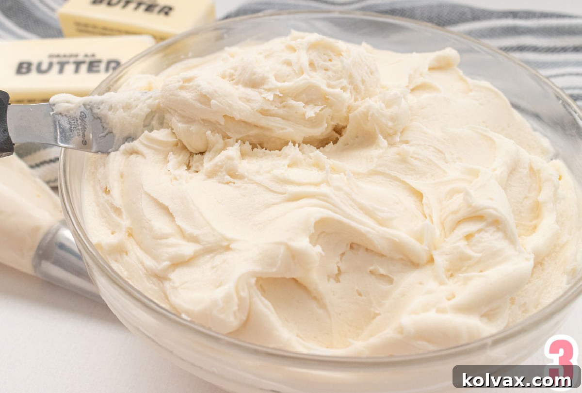 Closeup on a gleaming glass bowl generously filled with our signature Best Buttercream Frosting, perfectly smooth and ready for decorating.