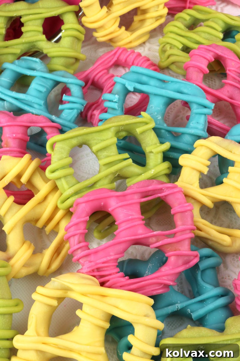 Close-up of freshly made Springtime Pretzels on parchment paper, showcasing their vibrant colors