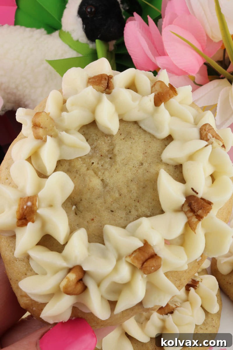 A collection of beautifully frosted Banana Cake Cookies, showcasing their appealing presentation