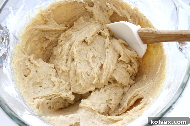 The combined banana cookie dough, enriched with dry ingredients, showcasing its readiness for baking