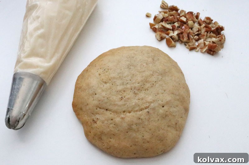 A bowl of rich and creamy homemade cream cheese frosting, the perfect complement to banana cake cookies