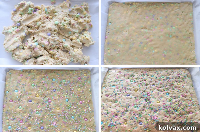 Preparing the Easter M&M Sugar Cookie Bar dough on a parchment-lined cookie sheet before baking, ensuring even distribution.