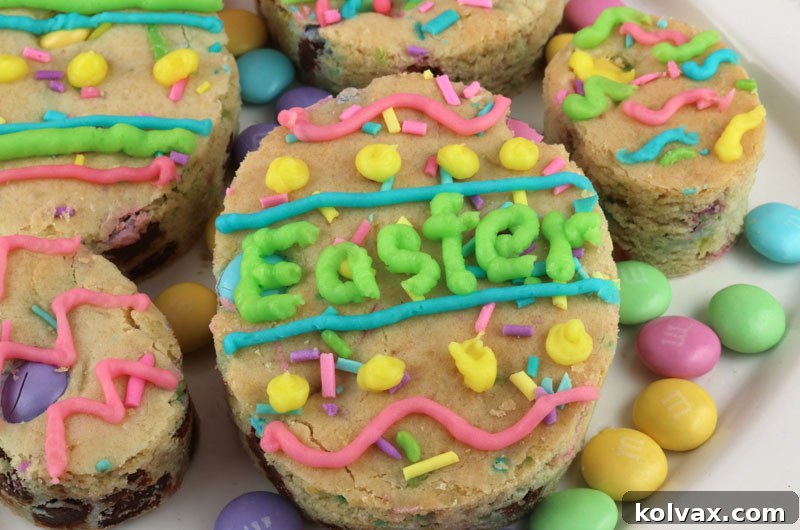Beautifully decorated Easter M&M Sugar Cookie Bars, resembling vibrant Easter eggs on a platter.