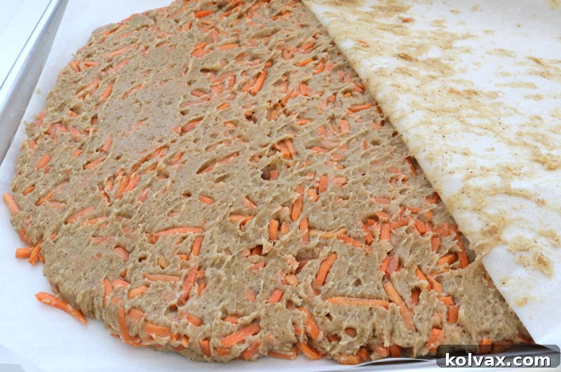 Pressing Down Carrot Cake Dough with Parchment Paper
