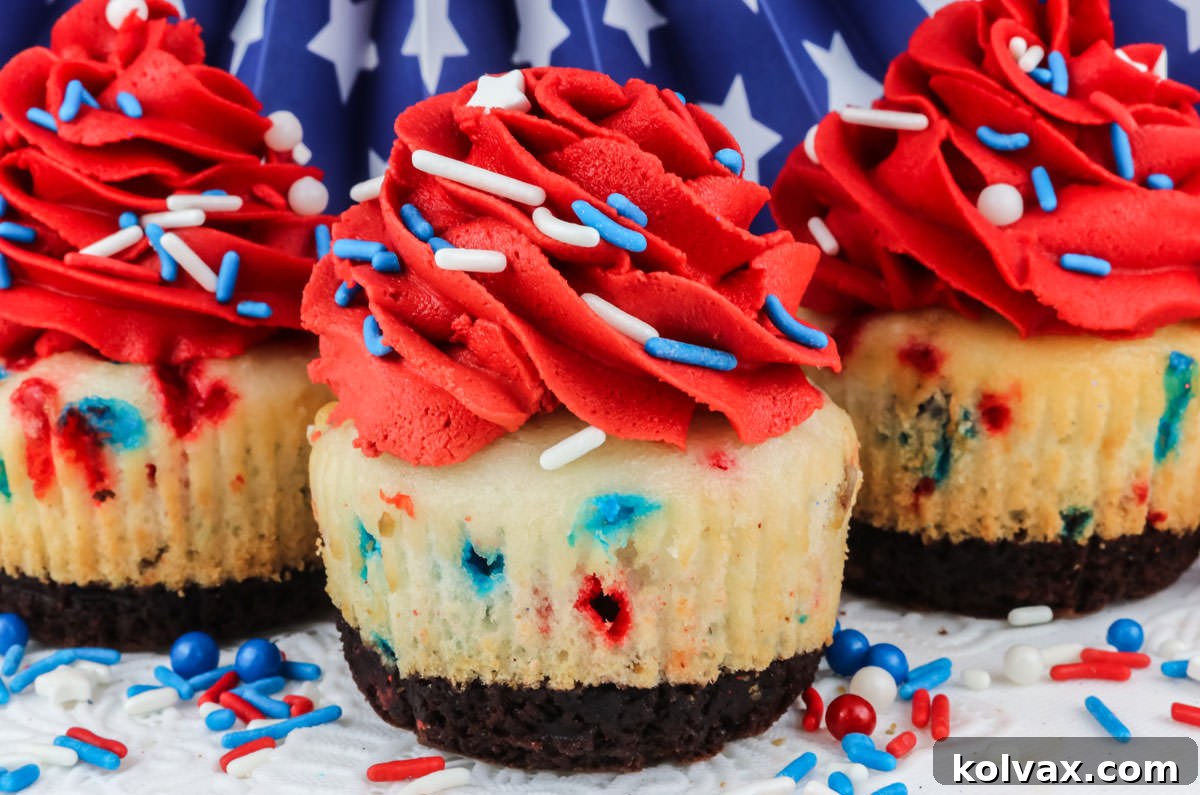 A captivating close-up of three decadent Patriotic Brownie Cupcakes, artfully arranged on a white table generously dusted with festive Red, White, and Blue sprinkles.