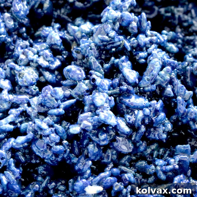 Deep navy blue colored Rice Krispie Treats, ideal for nautical or winter themes.