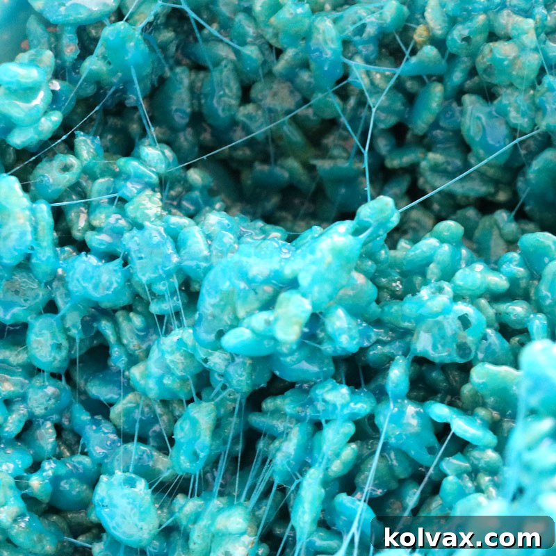 Soft light teal colored Rice Krispie Treats, evoking tranquility and freshness.