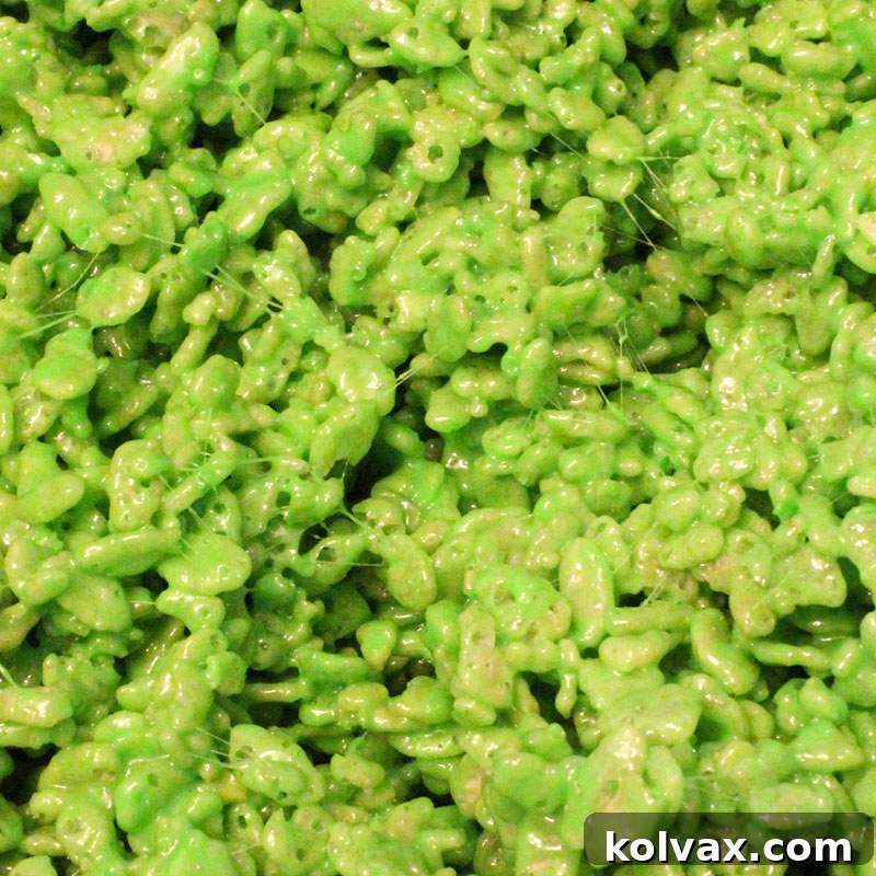 Whimsical Grinch green colored Rice Krispie Treats, perfect for holiday fun.