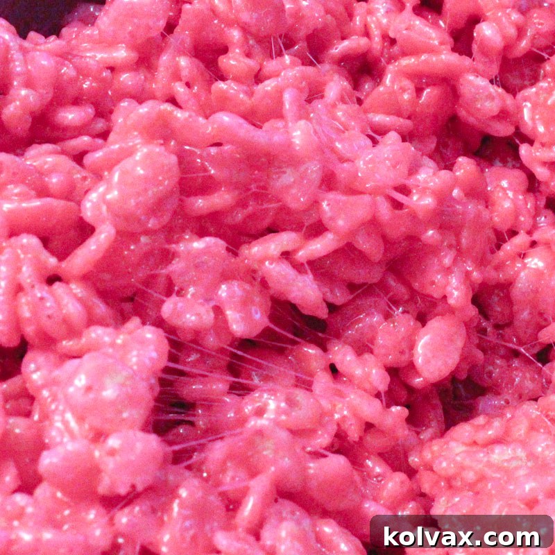 Vibrant bright pink colored Rice Krispie Treats, eye-catching and fun.