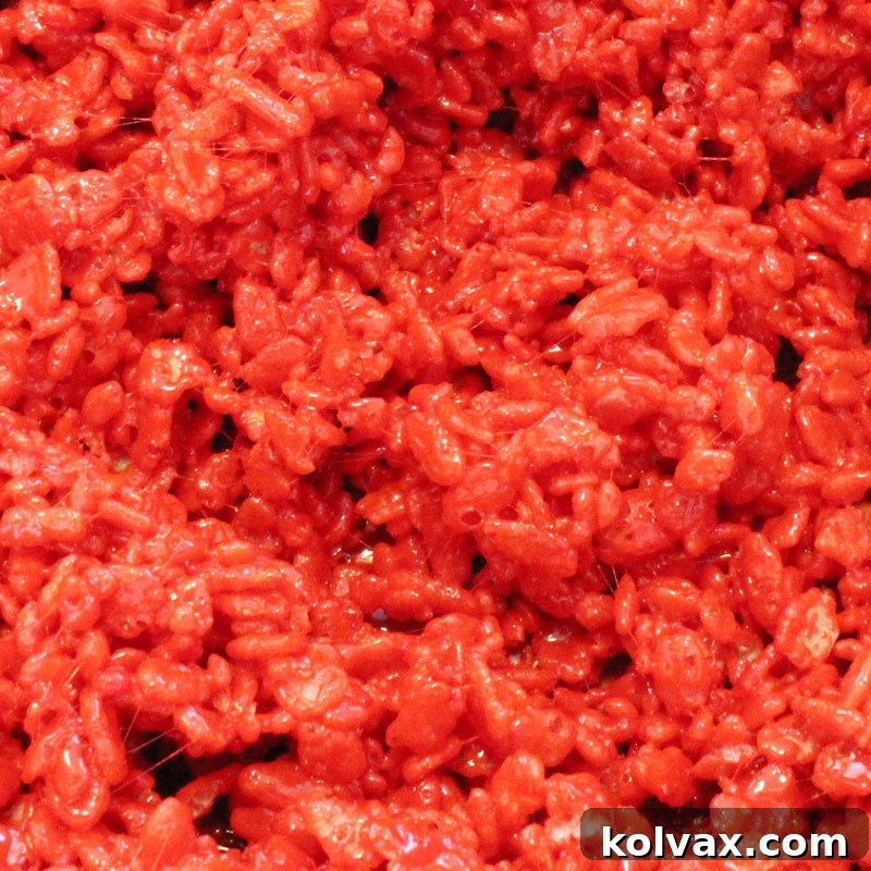 Rich red colored Rice Krispie Treats, perfect for holiday celebrations.