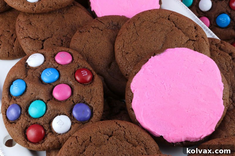 Delicious and versatile chocolate cookies, perfect for any occasion. Learn to make them plain, adorned with M&M's, or beautifully frosted with buttercream. This easy chocolate cookie recipe is a must-try for all cookie lovers! #ChocolateCookies #EasyCookieRecipe #MAndMcookies #FrostedCookies #HomemadeCookies #BakingIdeas