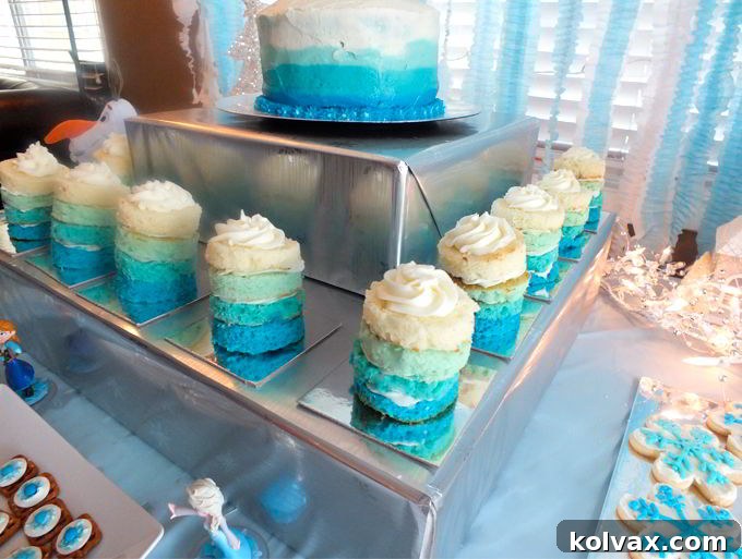 Disney Frozen Ombre Mini Cakes for a Frozen Birthday Party - so beautiful and very yummy! Try this unique take on a Frozen Cupcake for your own Frozen Party. And follow us for more great Frozen Party Ideas.