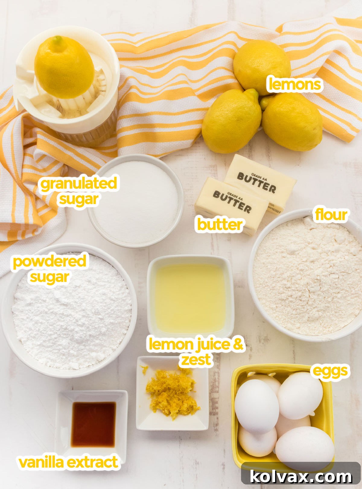 All the essential ingredients for baking a delicious Lemon Pound Cake, neatly arranged: fresh lemons, unsalted butter, granulated sugar, all-purpose flour, powdered sugar, lemon juice and zest, eggs, and vanilla extract.