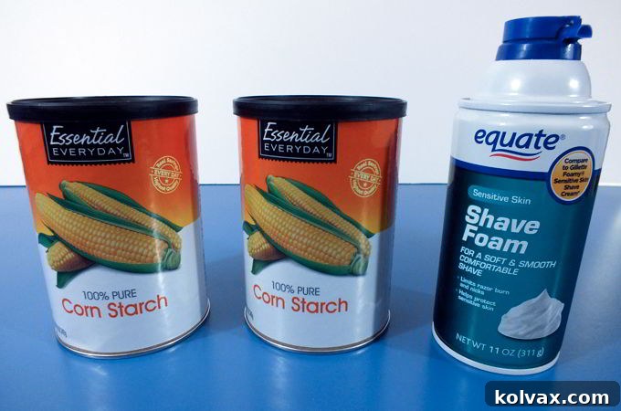 Ingredients for DIY Play Snow: cornstarch, shaving cream, and optional silver glitter. Simple and affordable items for a fun kids' activity.