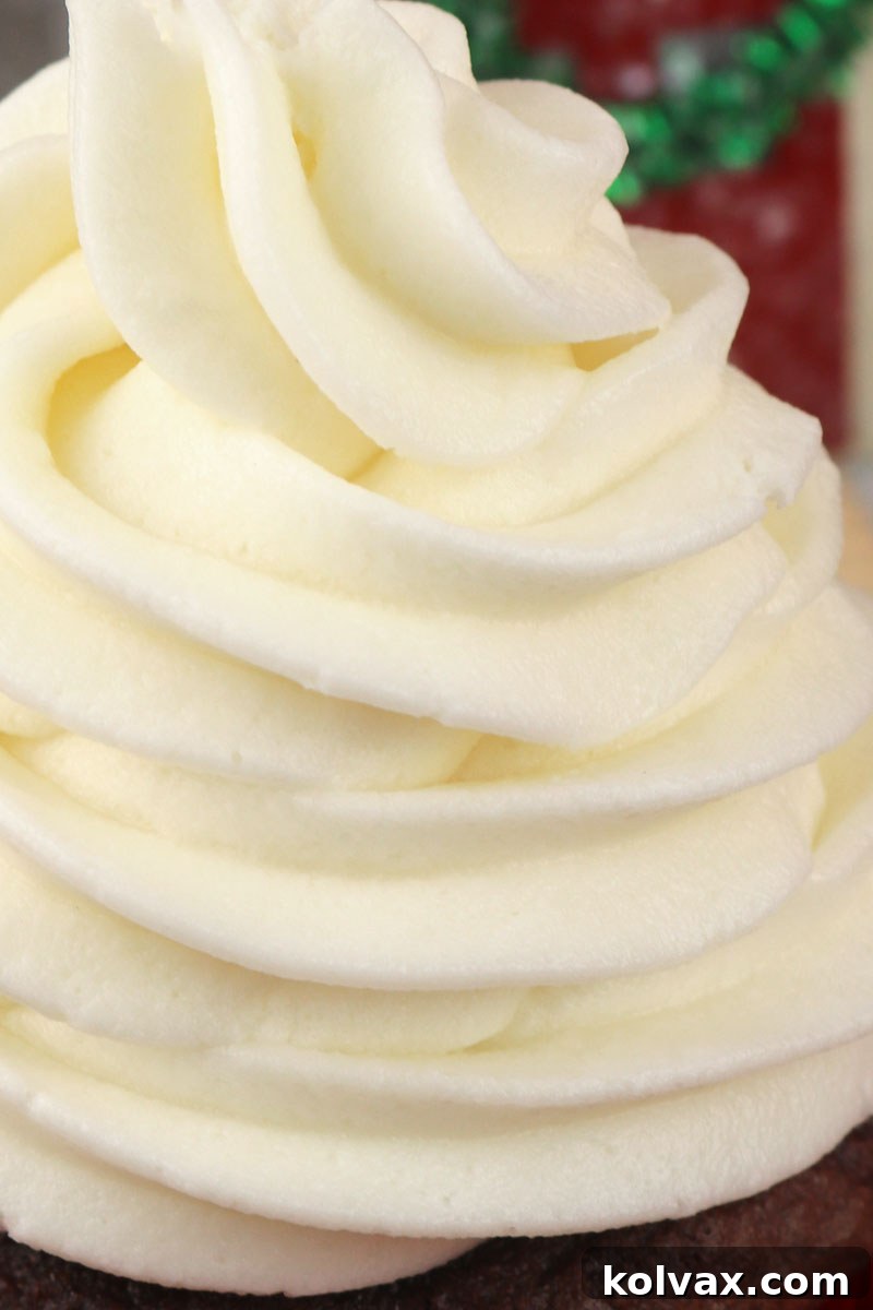 Beautifully piped Peppermint Whipped Cream Frosting on festive cupcakes