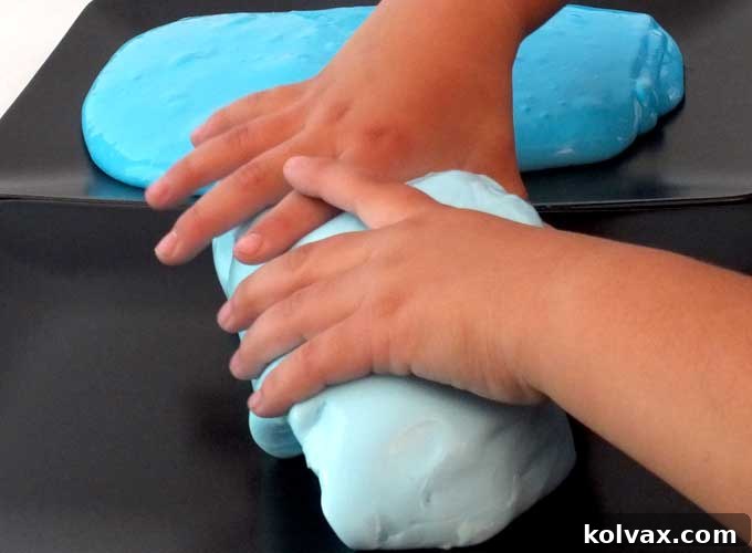 Disney Frozen Troll Slime - homemade GAK for a Frozen Birthday Party. Easy to make and great for a party activity or as party favors for the kids. We have step by step directions on how to make it. Follow us for more fun Frozen Party Ideas.