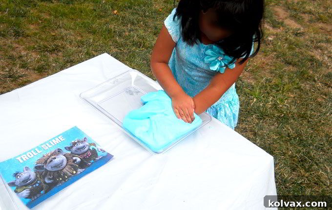Disney Frozen Troll Slime - homemade GAK for a Frozen Birthday Party. Easy to make and great for a party activity or as party favors for the kids. We have step by step directions on how to make it. Follow us for more fun Frozen Party Ideas.