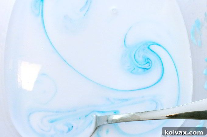 Add Food Coloring to Glue Mixture for Vibrant Troll Slime