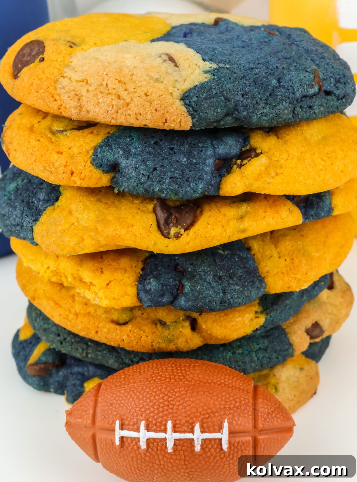Closeup on a stack of Los Angeles Rams Chocolate Chip Cookies sitting on a white table with a small toy football.