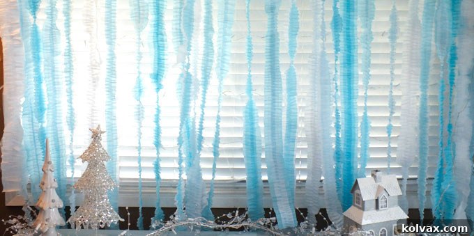 Disney Frozen DIY Ruffled Streamers - an easy and inexpensive party decoration project for a Frozen Birthday Party. We have all the directions you'll need to make this pretty party backdrop. Follow us for more Frozen Party Ideas.