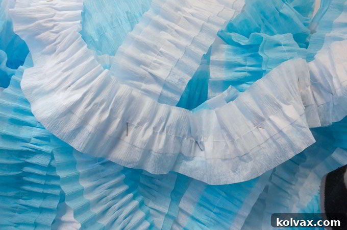 Attaching the ruffled streamers for the backdrop