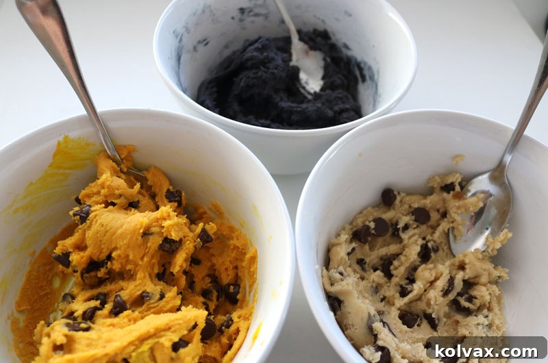 Assembled New Orleans Saints Chocolate Chip Cookies before baking, showing the beautiful marbled gold, black, and white dough with chocolate chips.