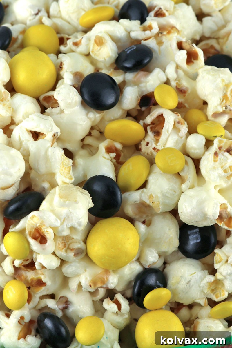 New Orleans Saints Popcorn - a festive, sweet, salty, and crunchy snack, perfect for game day, playoffs, or Super Bowl parties. Easy to make for any Saints fan.