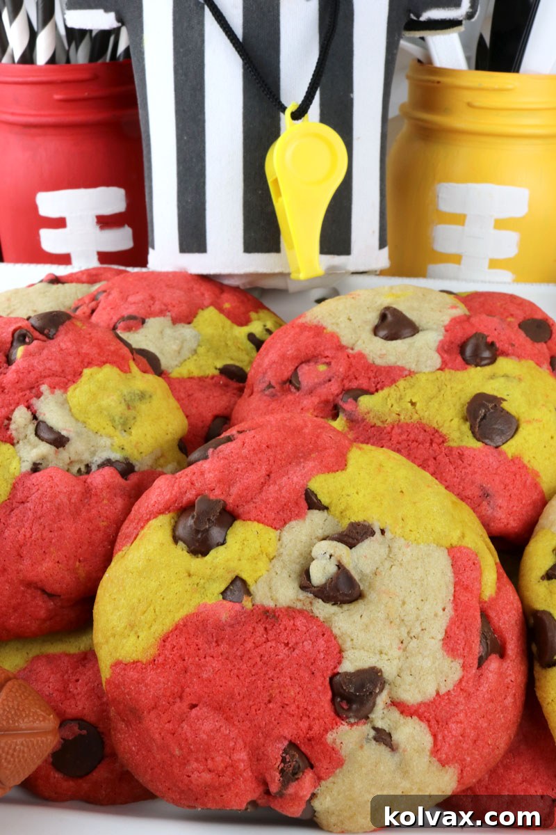 A vertical shot of a plate of Kansas City Chiefs Chocolate Chip Cookies, emphasizing their delicious appeal.