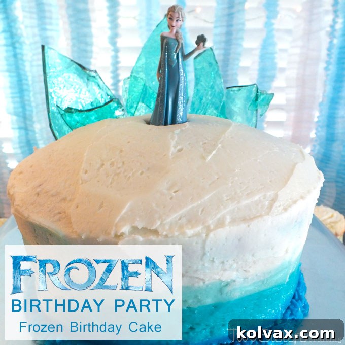 The enchanting Disney Frozen Birthday Cake with its perfect ombre frosting and a magnificent hard candy ice castle topper, a truly memorable centerpiece for any Frozen celebration.