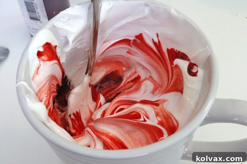 Adding food coloring to Royal Icing for vibrant designs