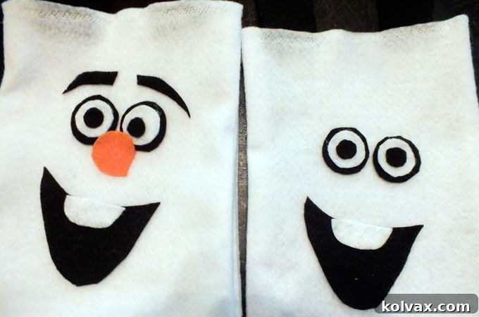 Applying Olaf's felt facial features with tacky glue onto the white party favor bag, creating his cheerful expression.