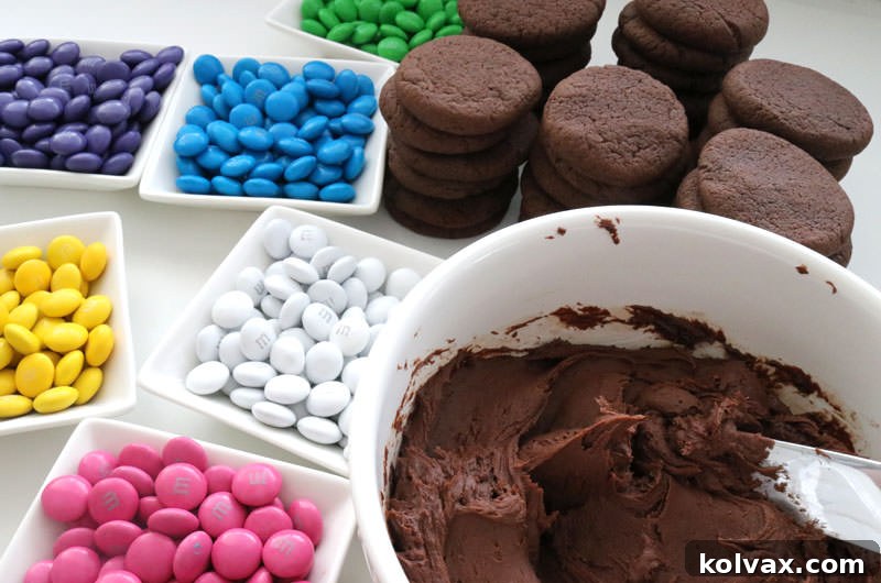 A bowl of rich, smooth chocolate buttercream frosting, ready to be spread onto cookies.